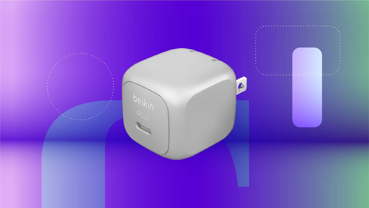 A silver USB-C wall charger against a purple gradient CNET background.