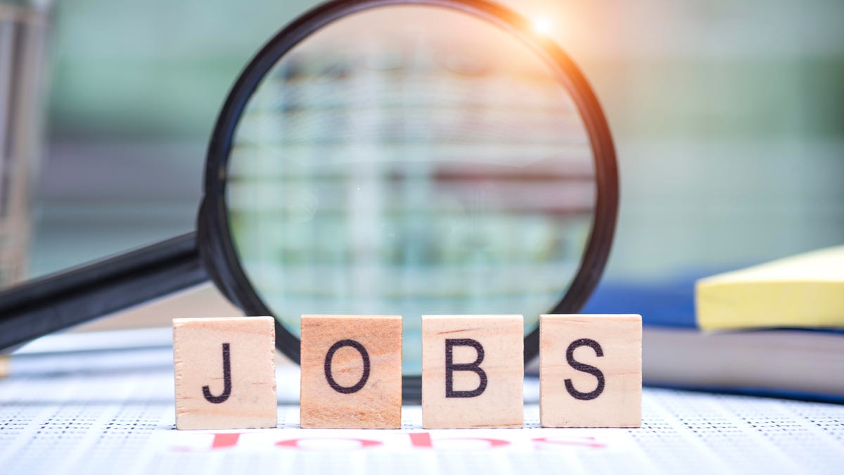 magnifying glass with scrabble pieces reading JOBS