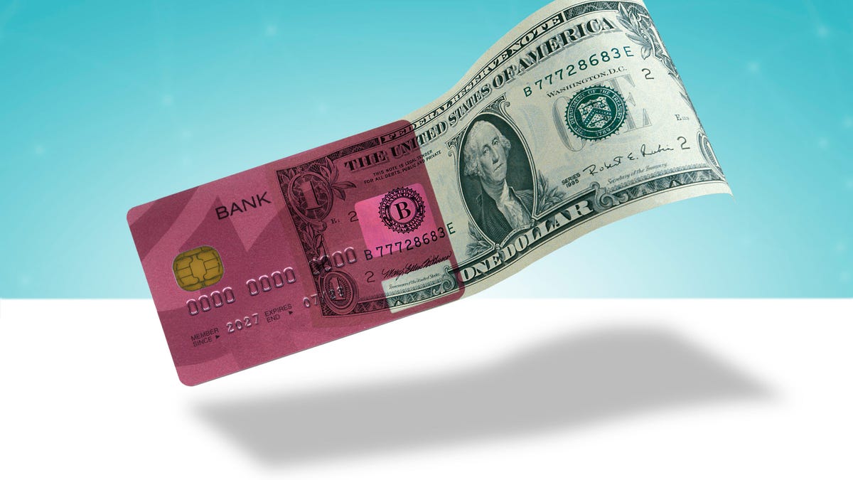 A dollar bill with a credit card.