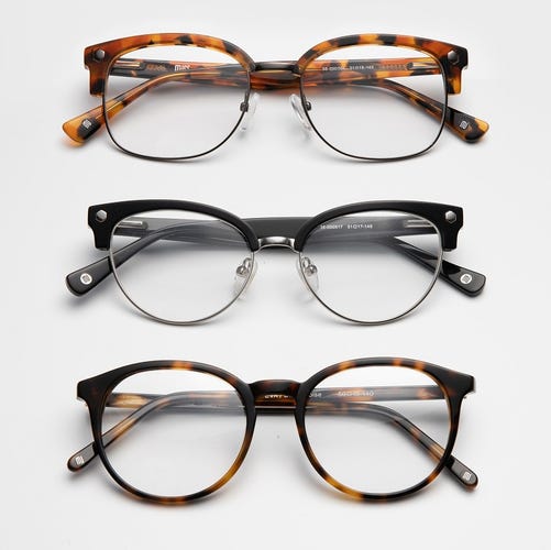 Three pairs of GlassesUSA glasses in black and tortoiseshell frames.
