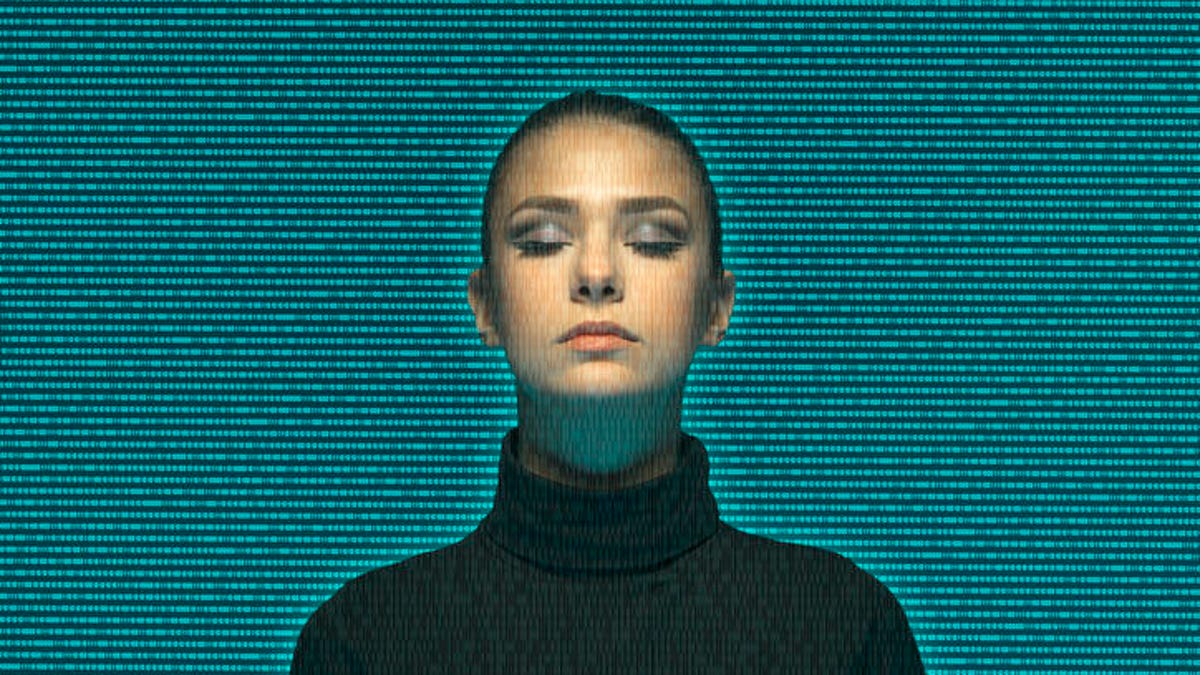 Woman seen through a mass of binary numbers