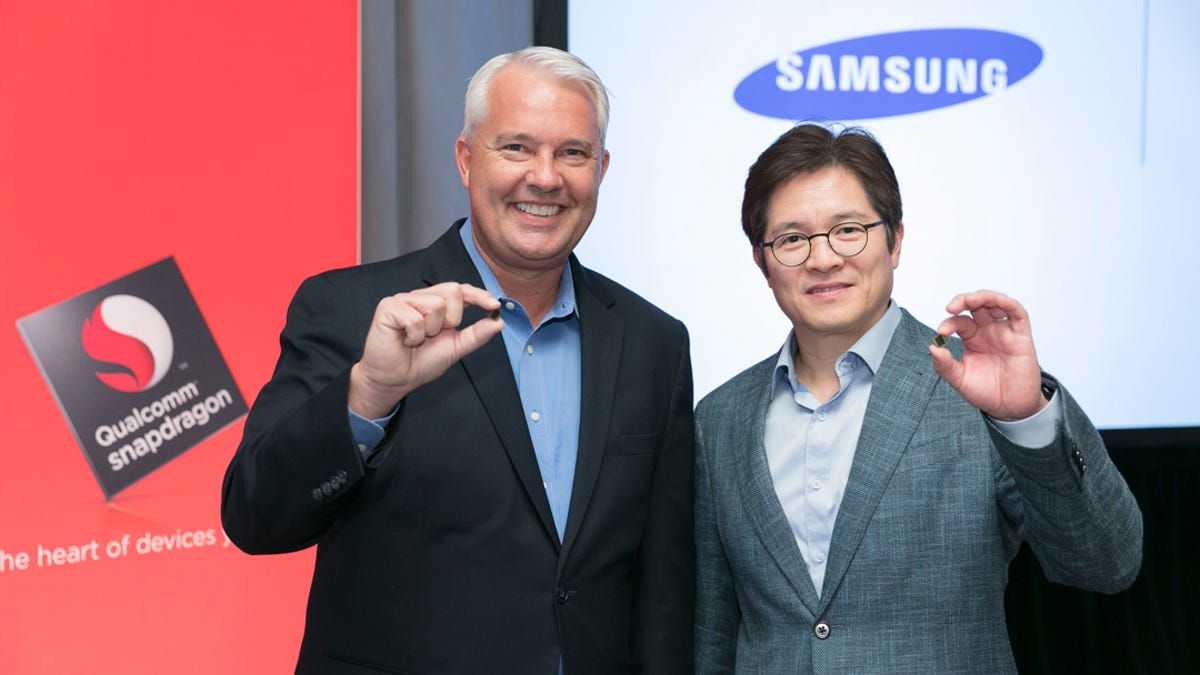 Keith Kressin, left, senior vice president of product management for Qualcomm, and Ben Suh, senior vice president of foundry marketing for Samsung, show off the Snapdragon 835.