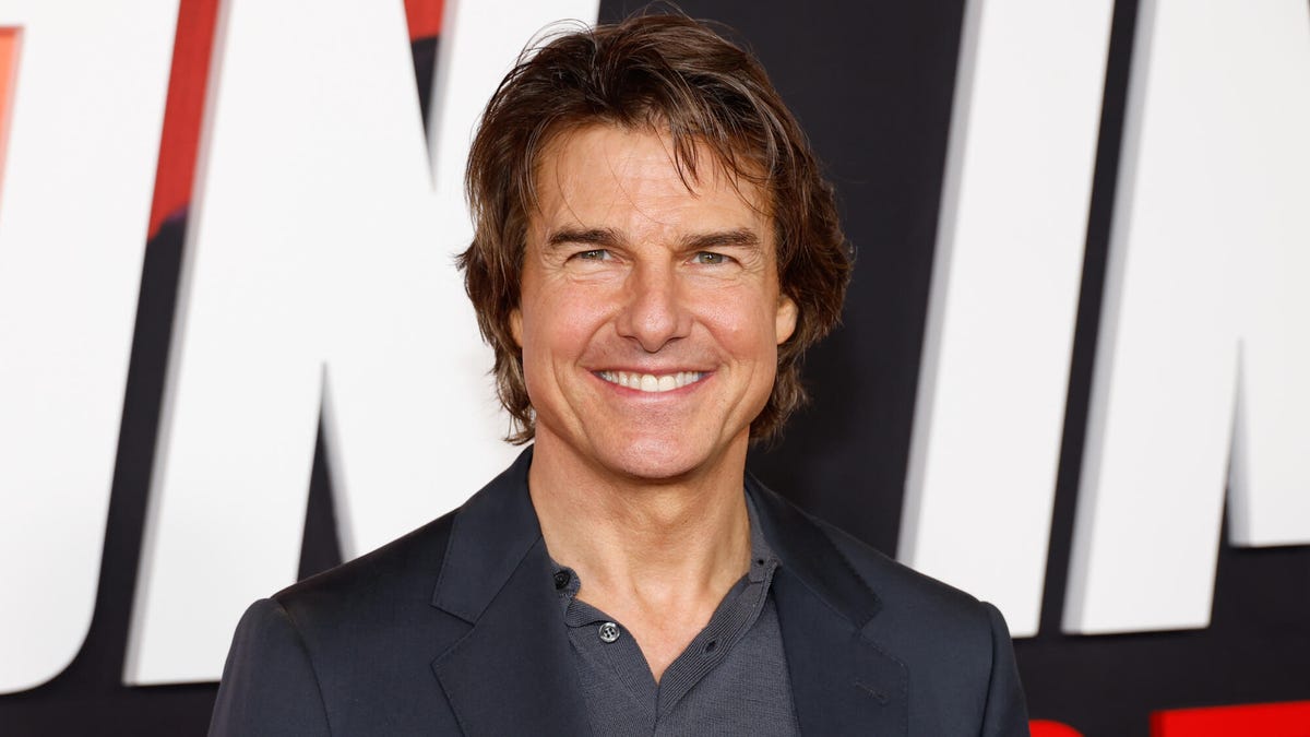 Actor Tom Cruise, smiling, looking toward the camera.
