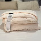 Rest Evercool Cooling Comforter on white bed.