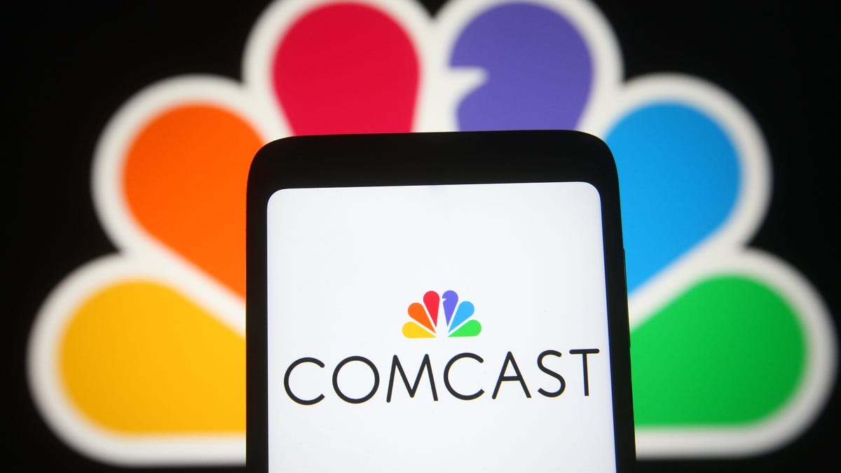 Comcast logo on a smartphone screen, with the logo in the background as well