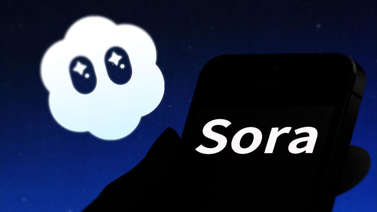 An image of the Sora logo floating above the word Sora displayed on a black phone (gettyimages-2240283196)