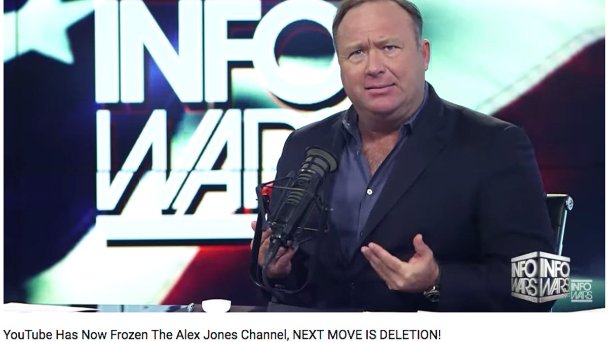 A screenshot of Alex Jones speaking in a YouTube video