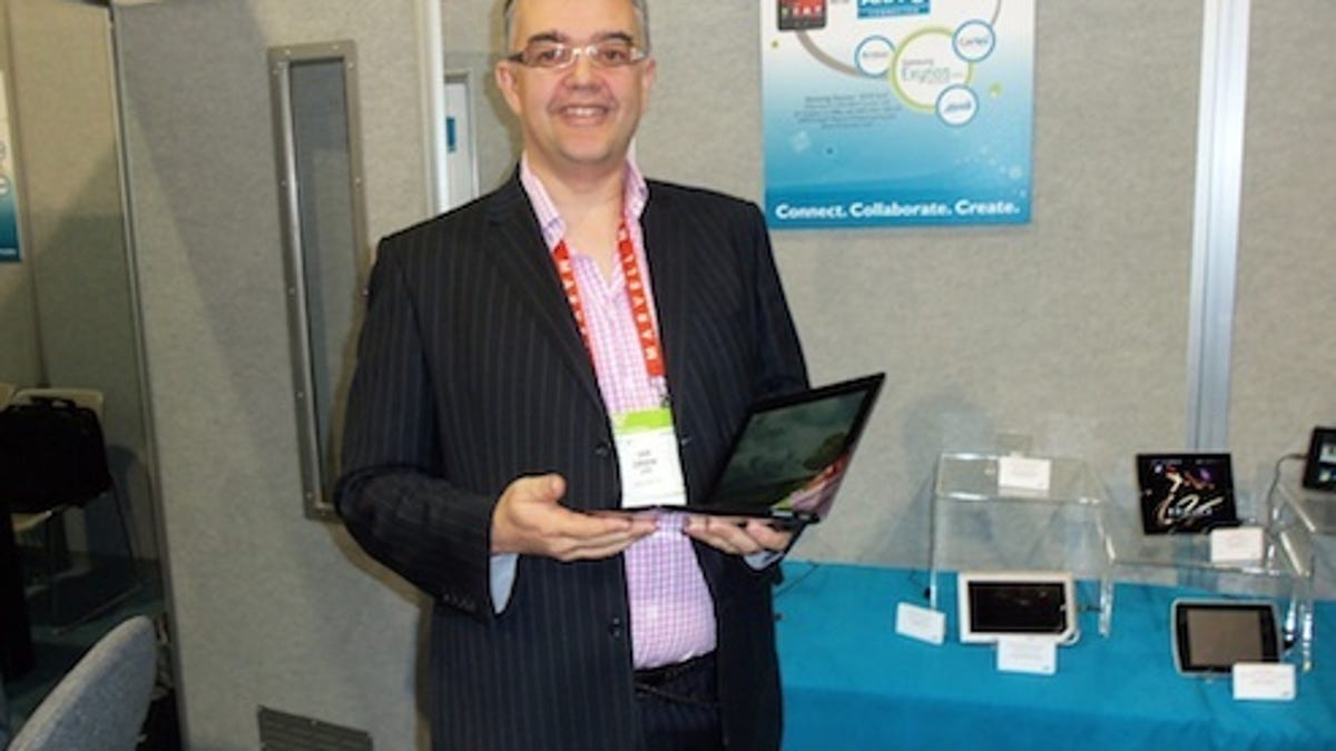 ARM executive vice president strategy: Ian Drew holding the Asus Transformer Prime hybrid tablet powered by a quad-core ARM processor.