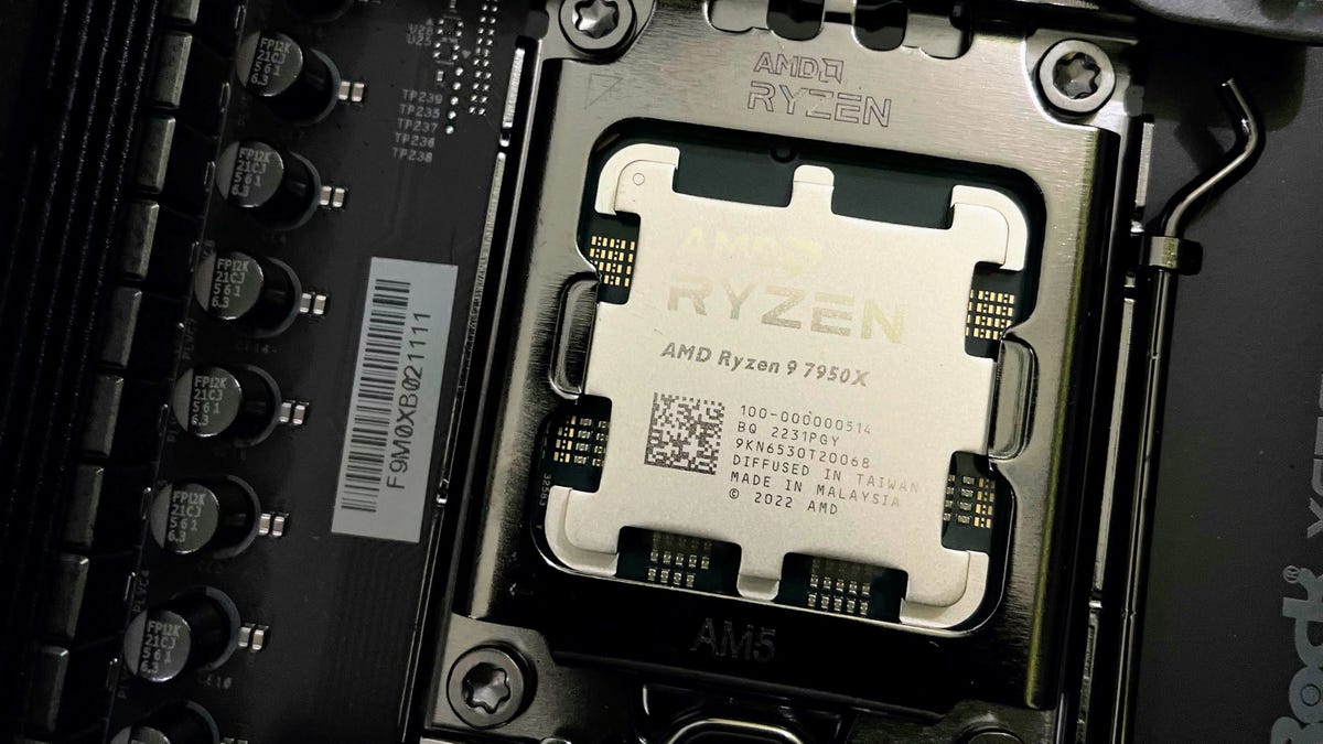 AMD Ryzen 7950X installed on a black PCB motherboard