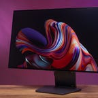 LG Ultragear 32-inch monitor angled left against a purple and magenta background
