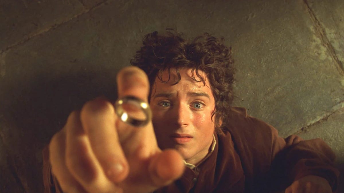 Frodo is about to put the One Ring on
