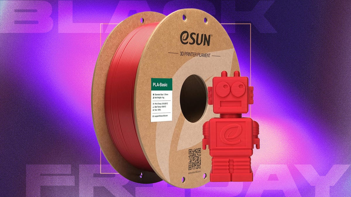 Red 3D printer filament spool next to a 3d printed robot displayed against a gradient purple background