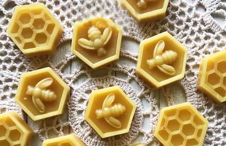 Gummy or chocolate molds depicting bees and honey combs