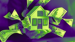 stretched out hand holding a doll house with dollar sign symbols around.