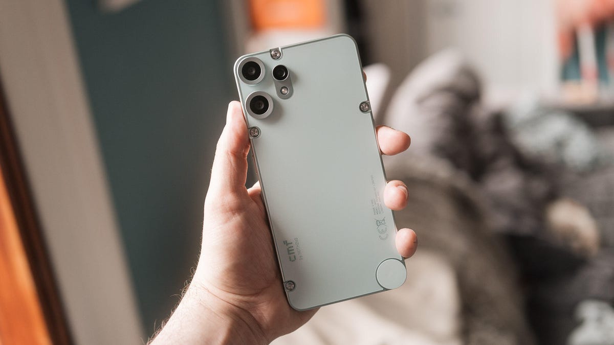 Image of a hand holding a phone