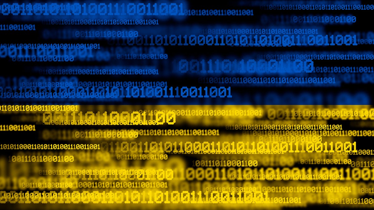 Lines of binary code, some of it blurry, in blue and yellow