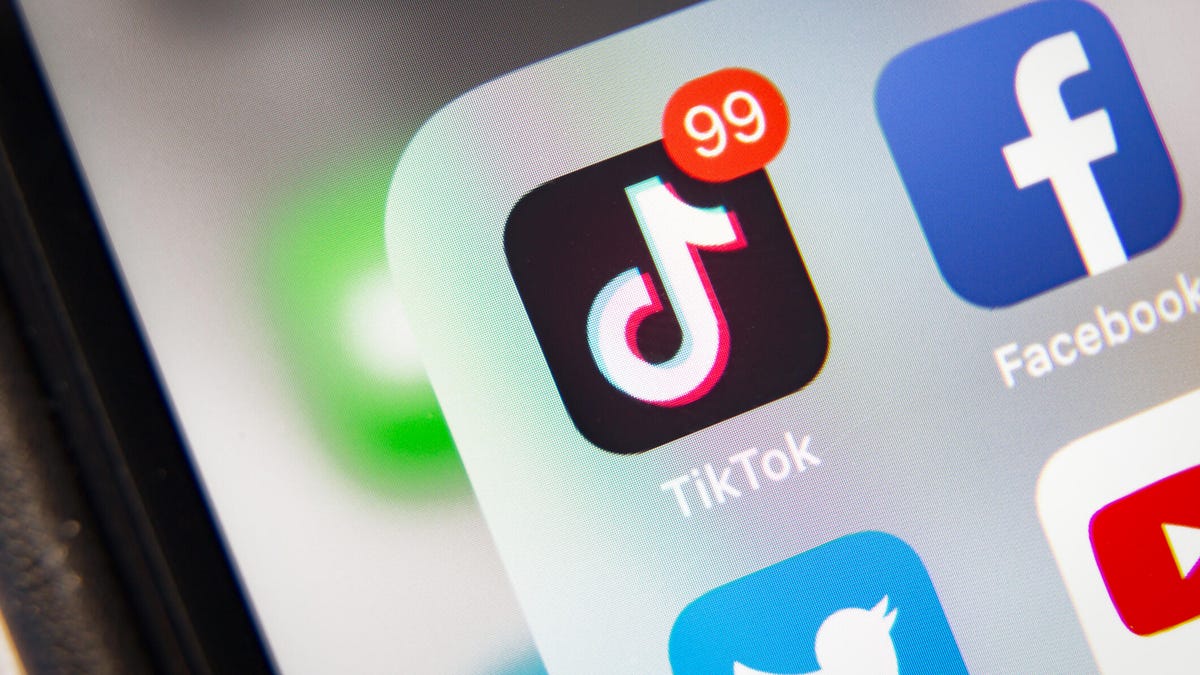 An image of the TikTok app logo on a phone.