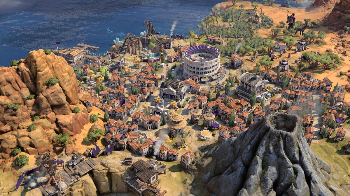 An in-game screenshot of a Roman city with a volcano