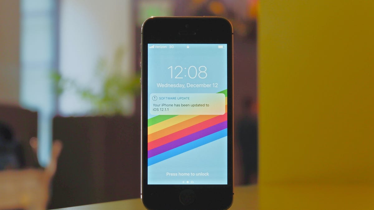 Apple iPhone 5S standing upright on a table