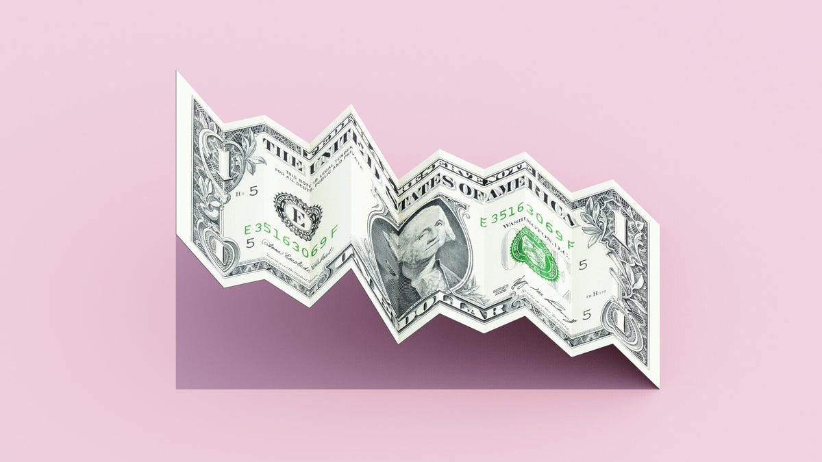 Dollar banknote shaped like a falling graph