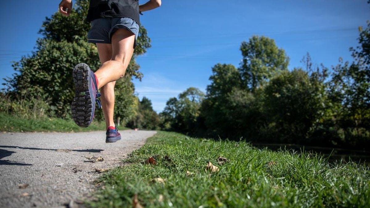 person running on path outside