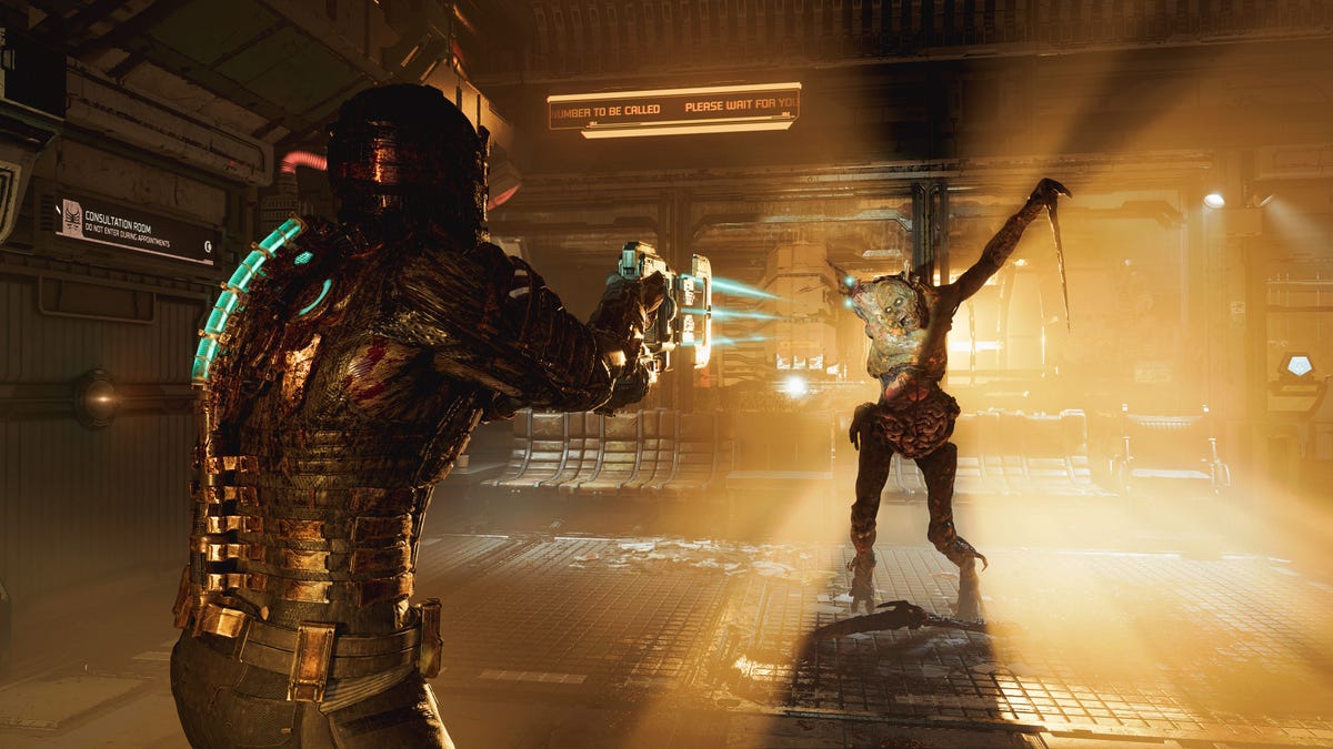Isaac Clarke shoots the arm off a necromorph bathed in light in the 2023 Dead Space remake.