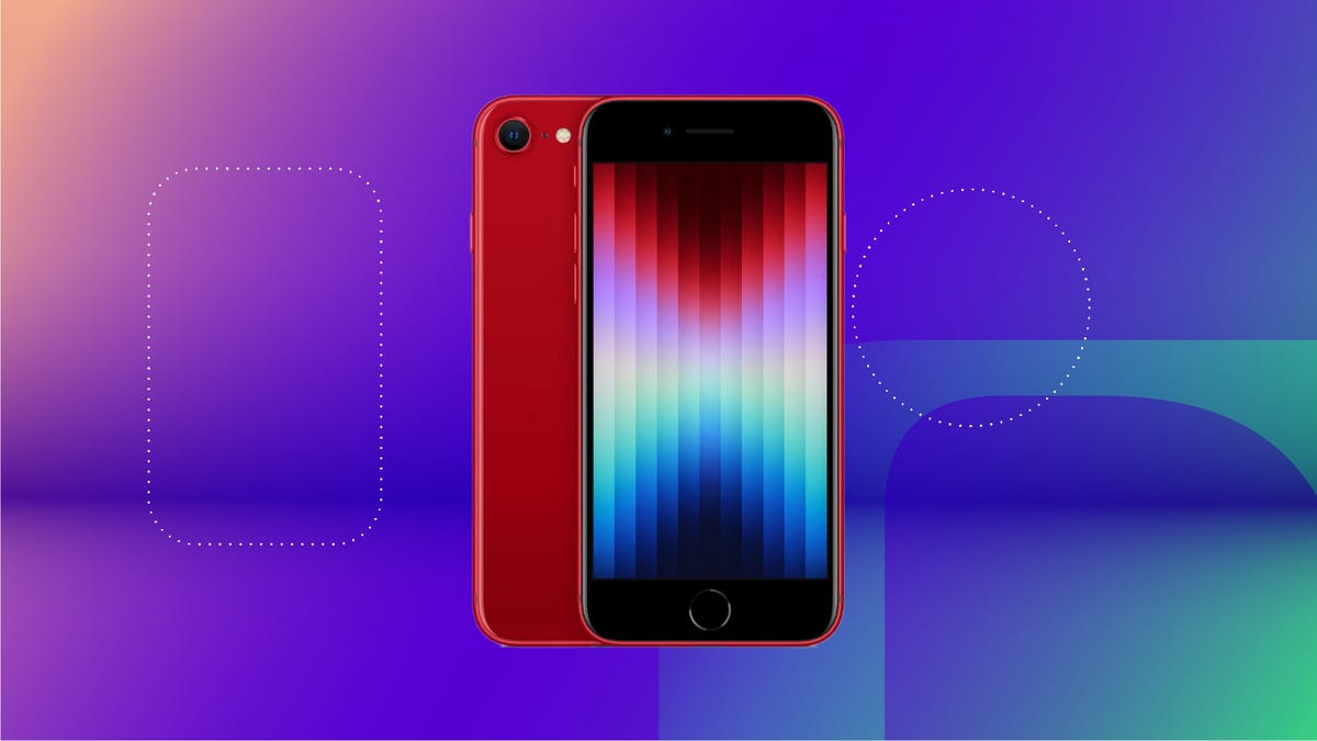 An iPhone SE 3rd Generation in red on a blue, purple, green and orange background.