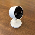 A Tap C120 cam on a wood table.