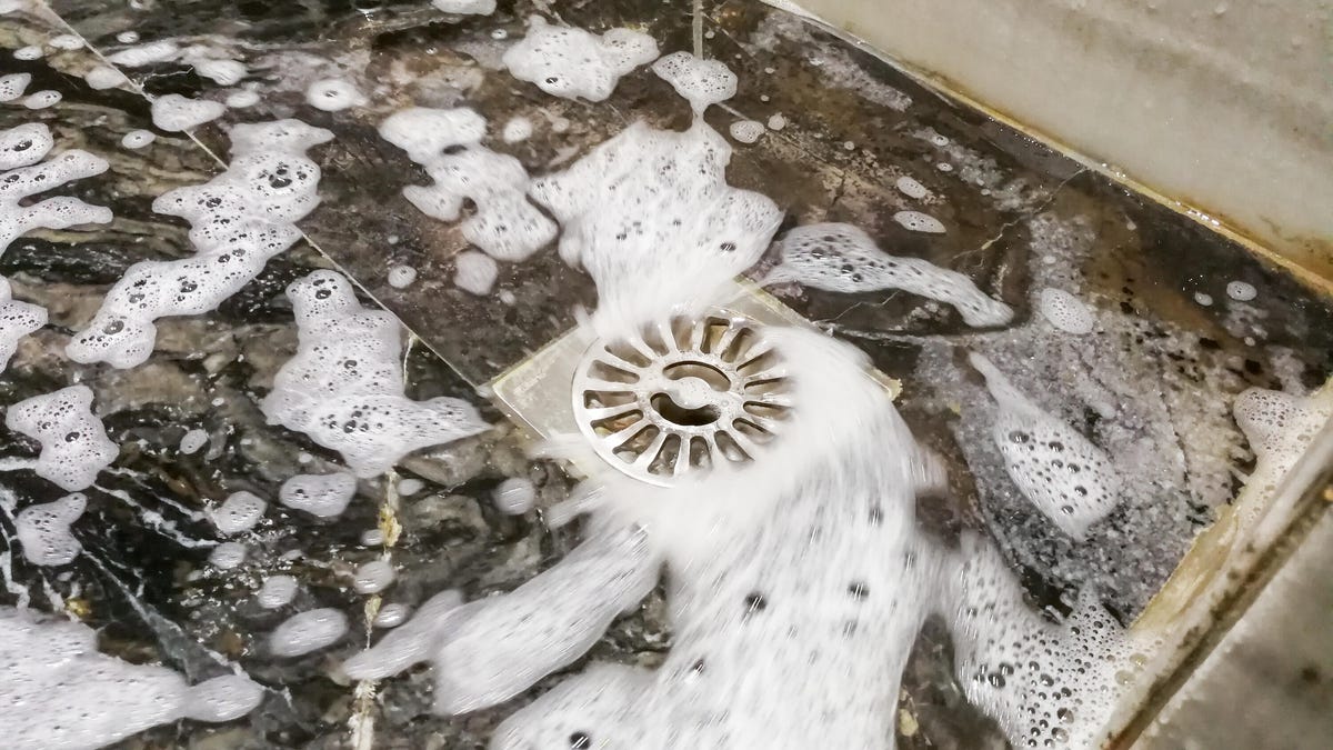shower drain with soapy water collecting