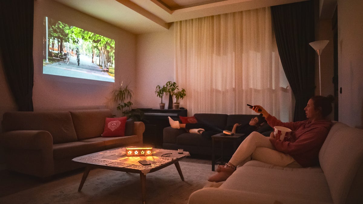 A small room with a projected image on the wall.