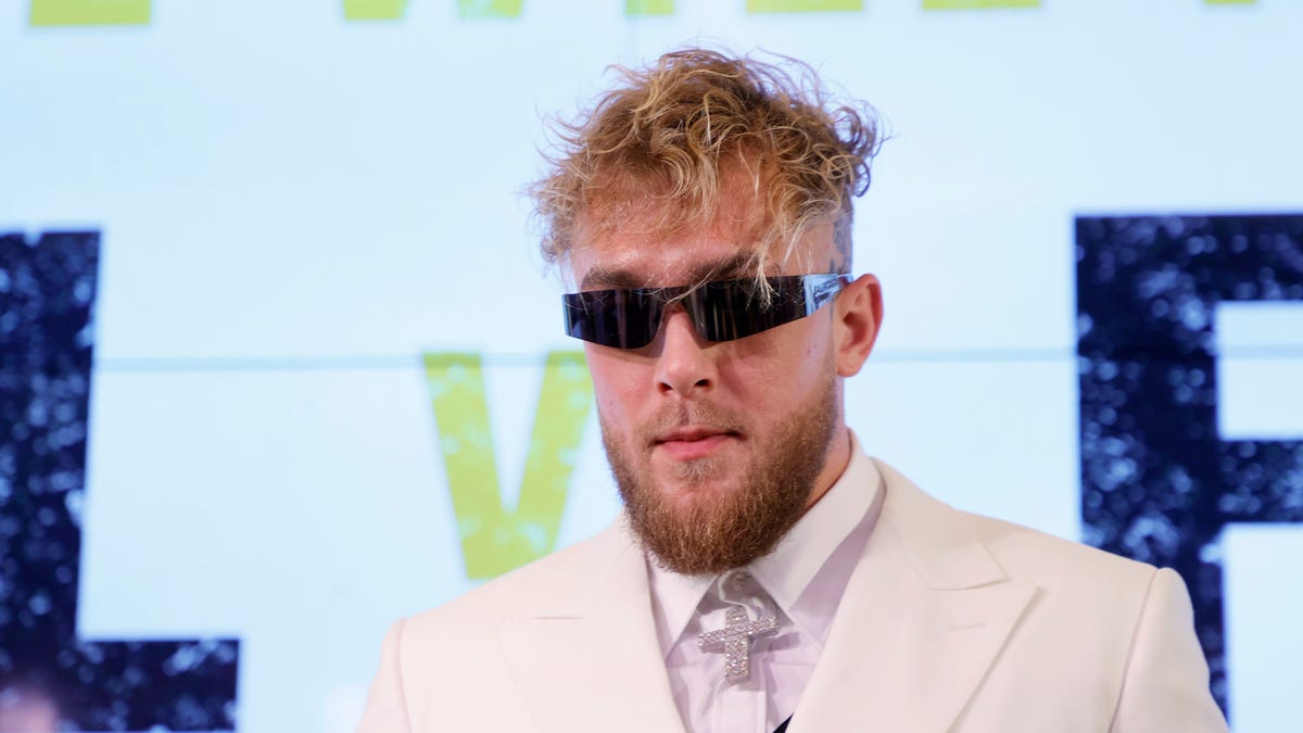 Jake Paul in a suit wearing sunglasses