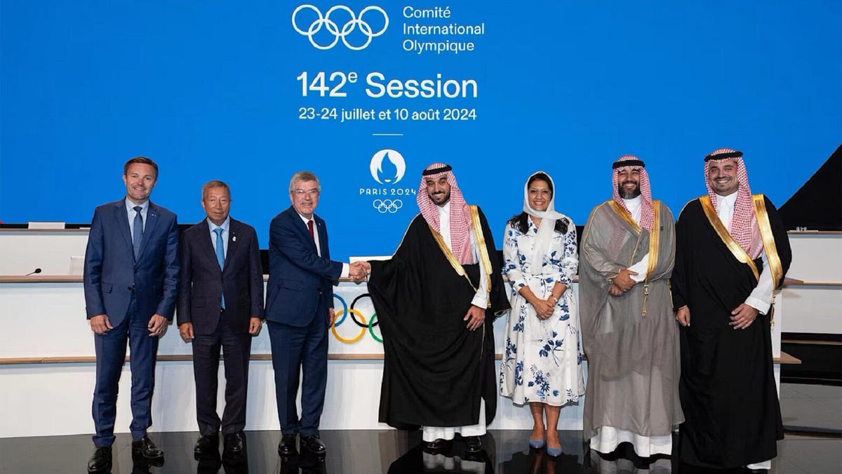 Members of the international olympic committee and representatives from the Kingdom of Saudi Arabia.