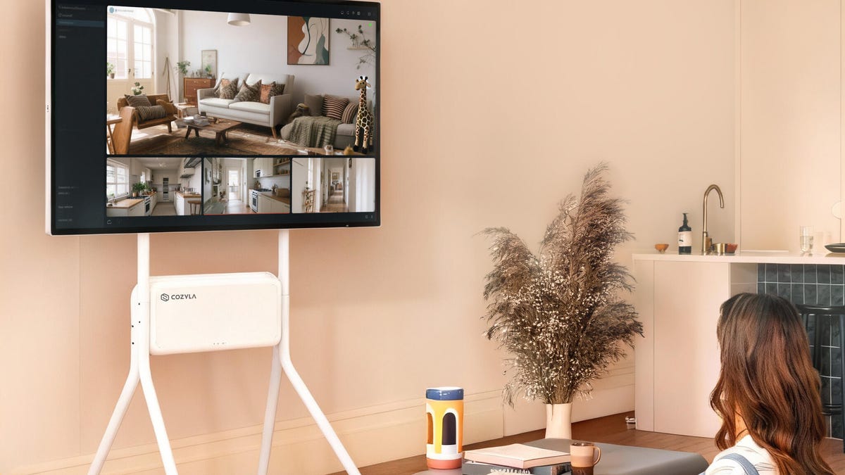 A Calendar Max Plus smart display shows security feeds in a living room.