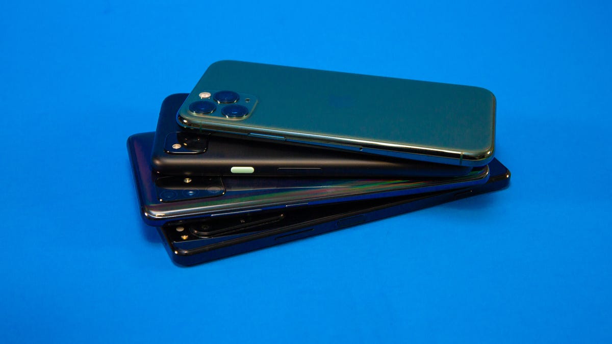 A stack of four phones