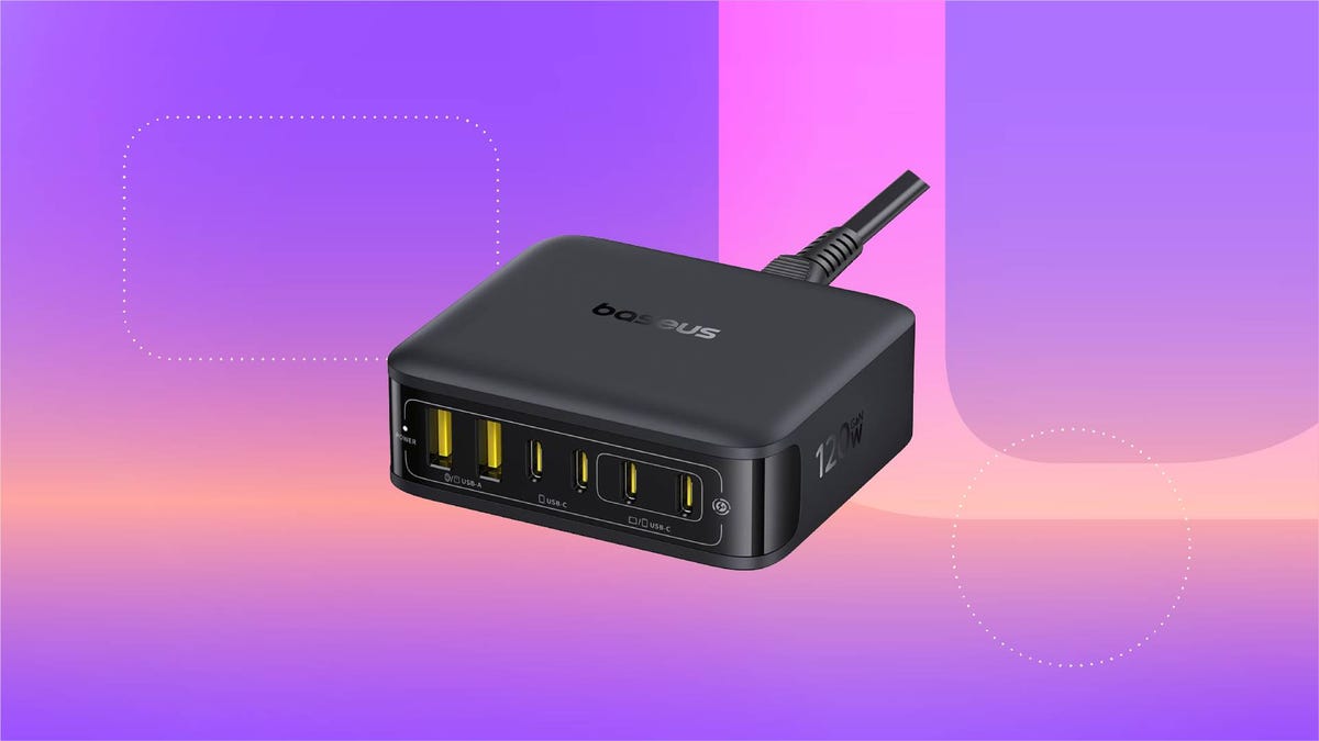 A black charging station against a purple gradient CNET background.