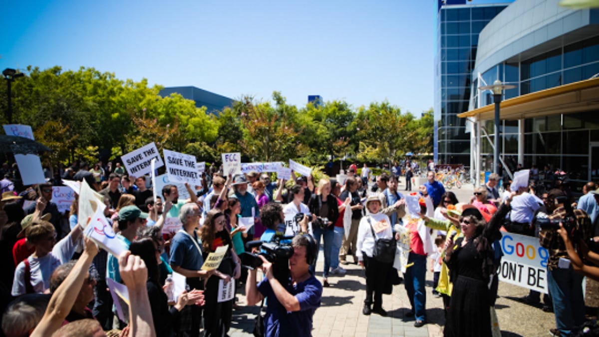 Several dozen protestors gathered outside Google headquarters in Mountain View, Calif., Friday to protest the company's proposed net neutrality regulations.