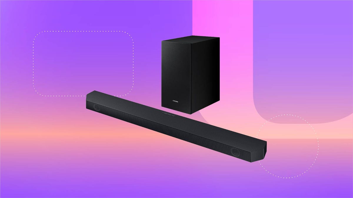 A black soundbar and subwoofer against a purple gradient CNET background.