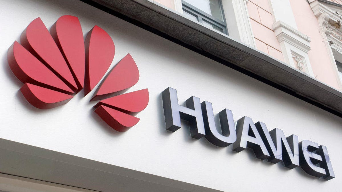 Huawei logo seen at the entrance to a Huawei brand store in