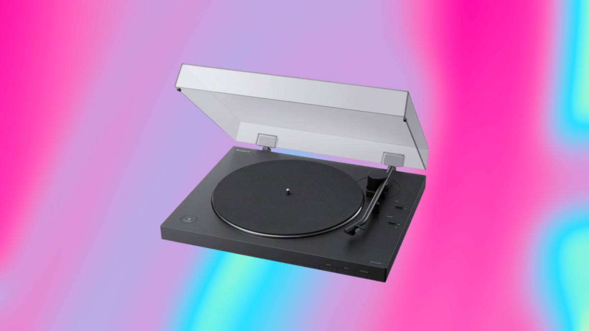 Turntable record player displayed against a swirling hot pink and turquoise background