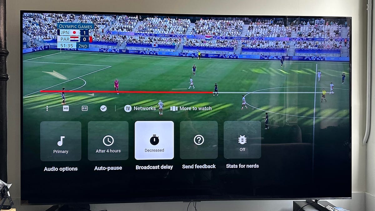 YouTube TV app on a TV showing menu option for decreased latency
