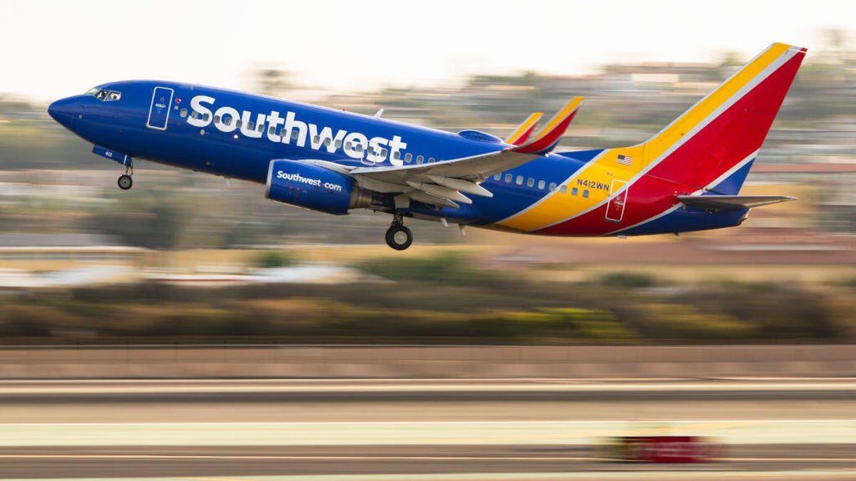 A Southwest plane takes off from an airport.