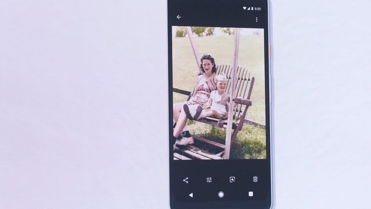 Google Photos' new AI feature shown on a smartphone.