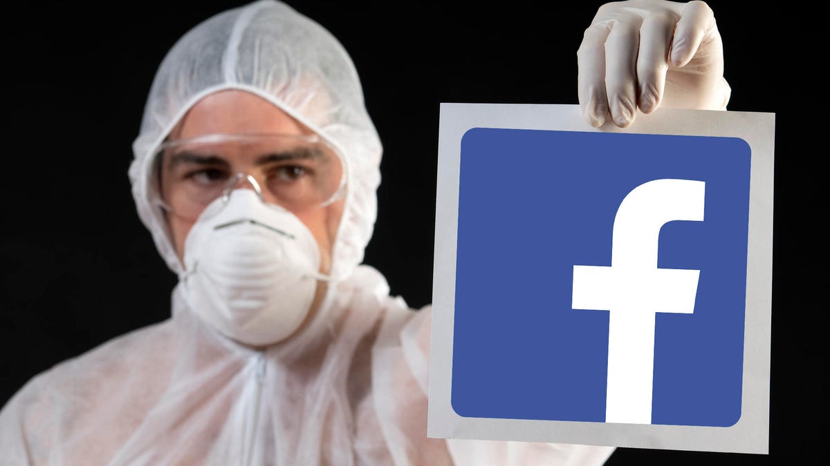 A laboratory worker with a sign in his hand biohazard