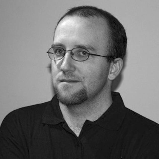 Headshot of Alex Kidman