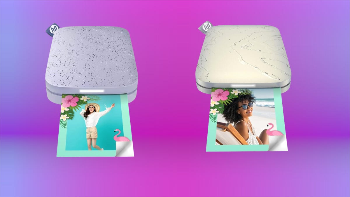 Left: lavender photo printer, right: grey photo printer both with photo coming out of slot. Background: purple and violet gradient.