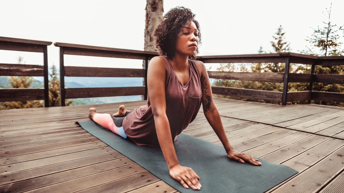 Young woman in a cobra pose