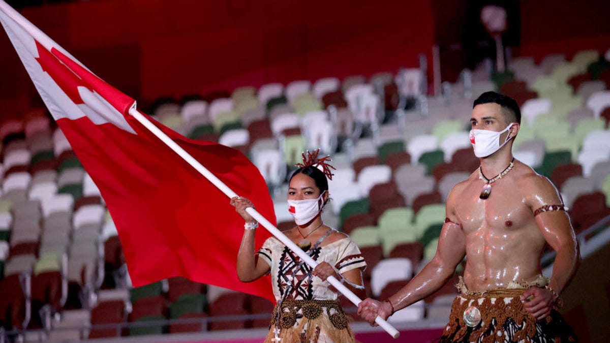 Malia Paseka and Pita Taufatofua of Team Tonga lead their team during the Opening Ceremony of the Tokyo 2020 Olympic Games.