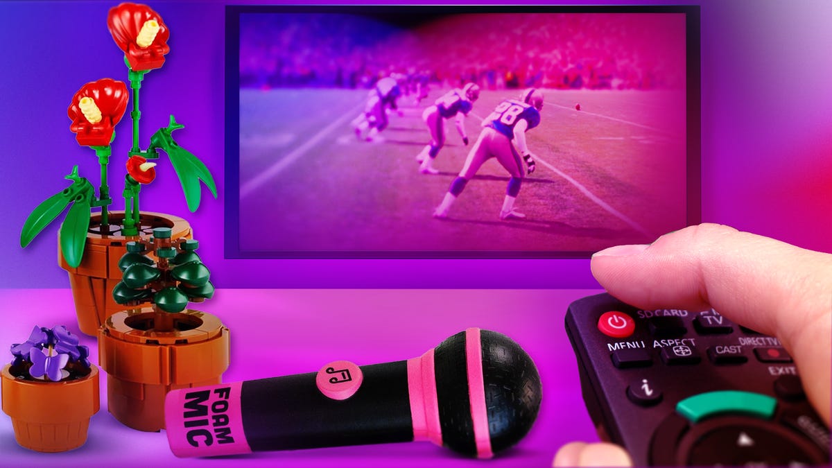 A remote is pointed at a TV that is showing the Super Bowl. A person's finger hovers over the power button, readying to turn off the TV. A Lego plant and foam microphone are in the foreground.