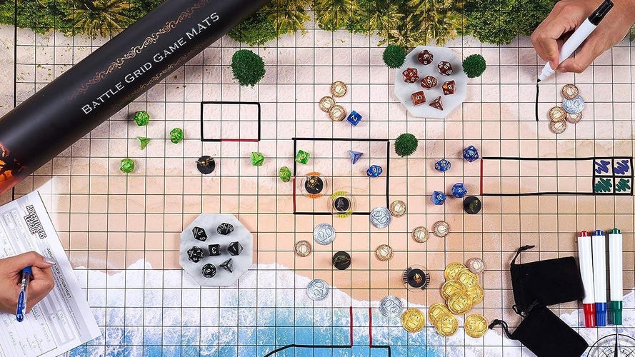 A beach battle map with dice and miniatures on it