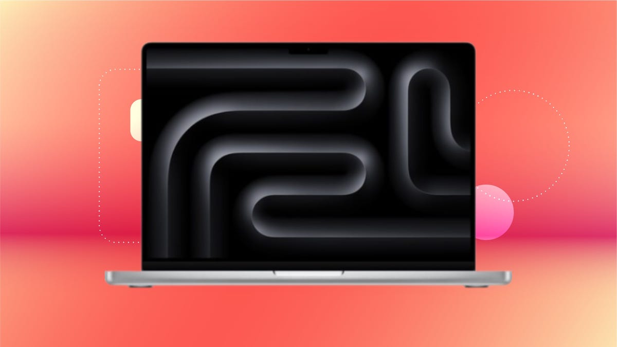 Silver MacBook Pro with black swirling display against a gradient orange pink background